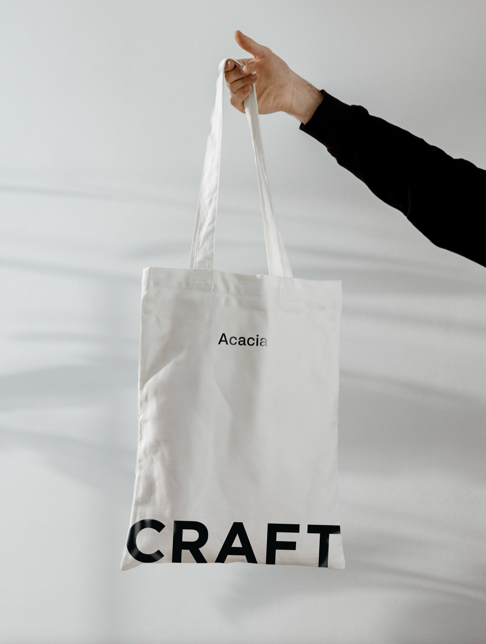 Hand holding a Craft tote bag