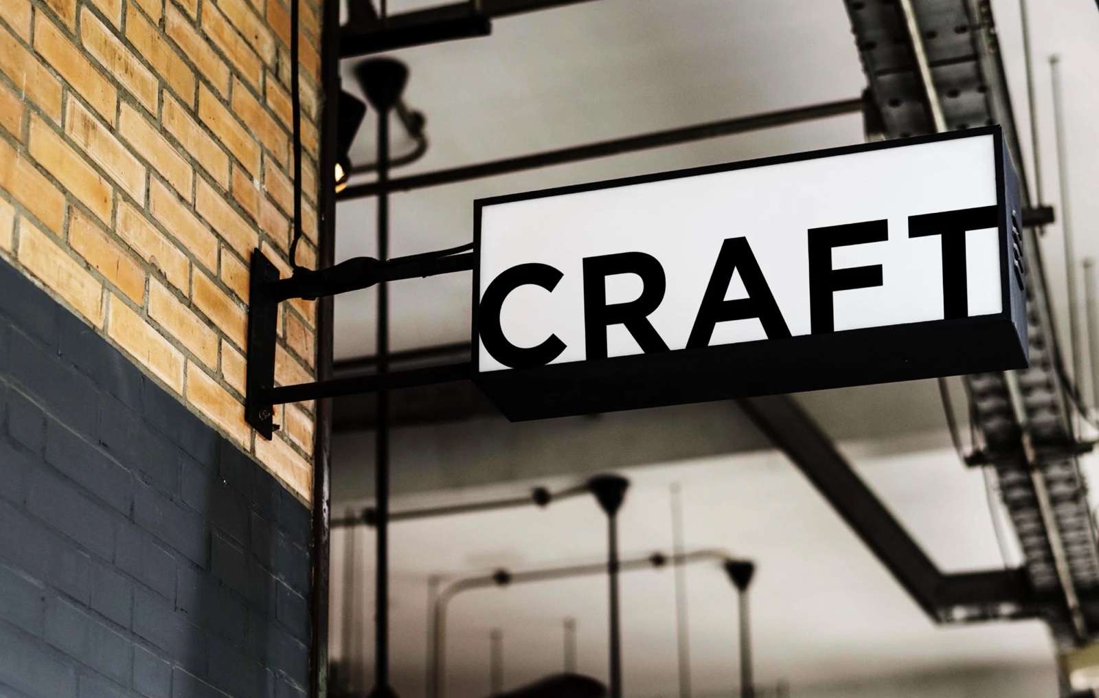 Craft lightbox sign on a brick wall