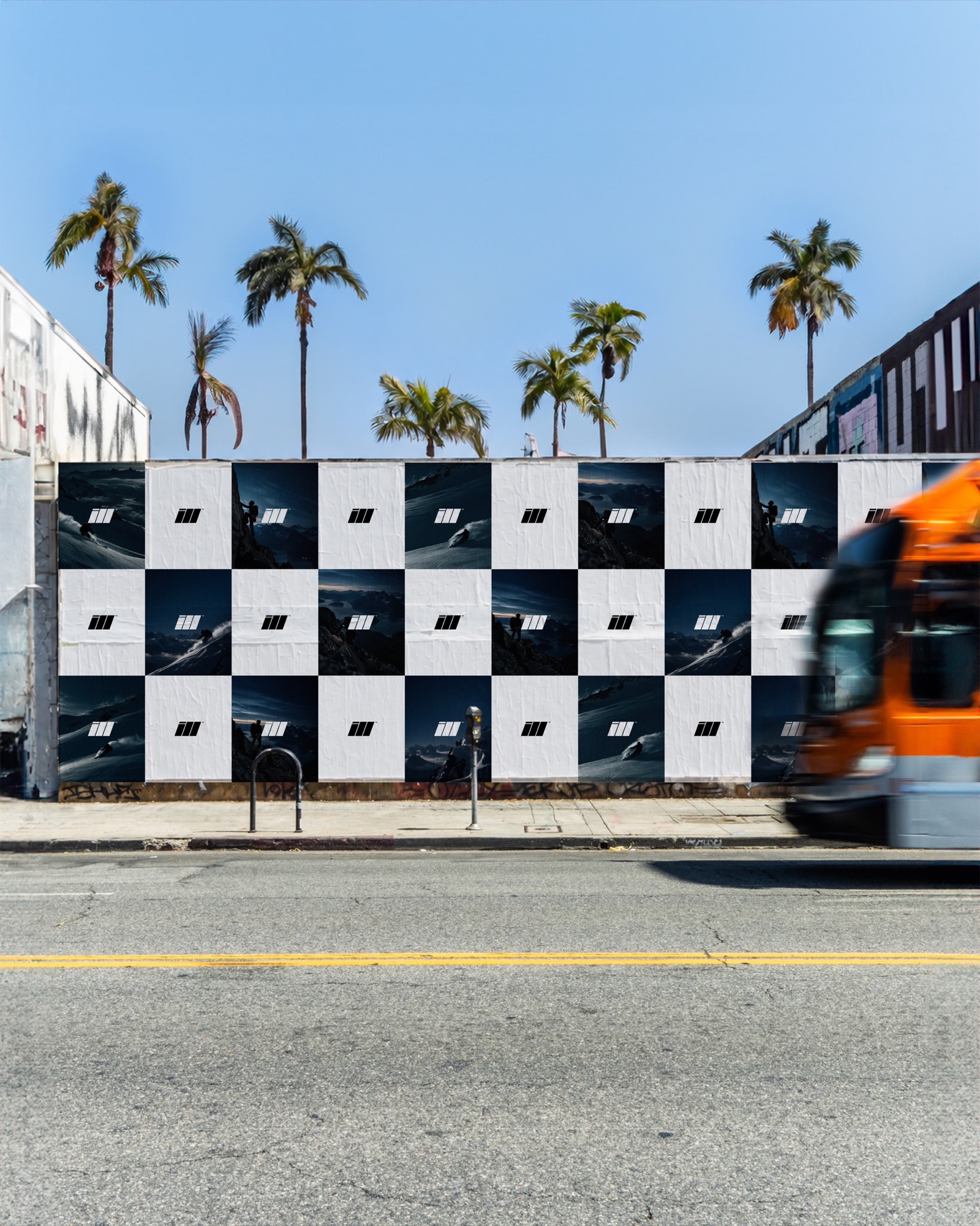 ILL poster wall under palm trees with a passing bus