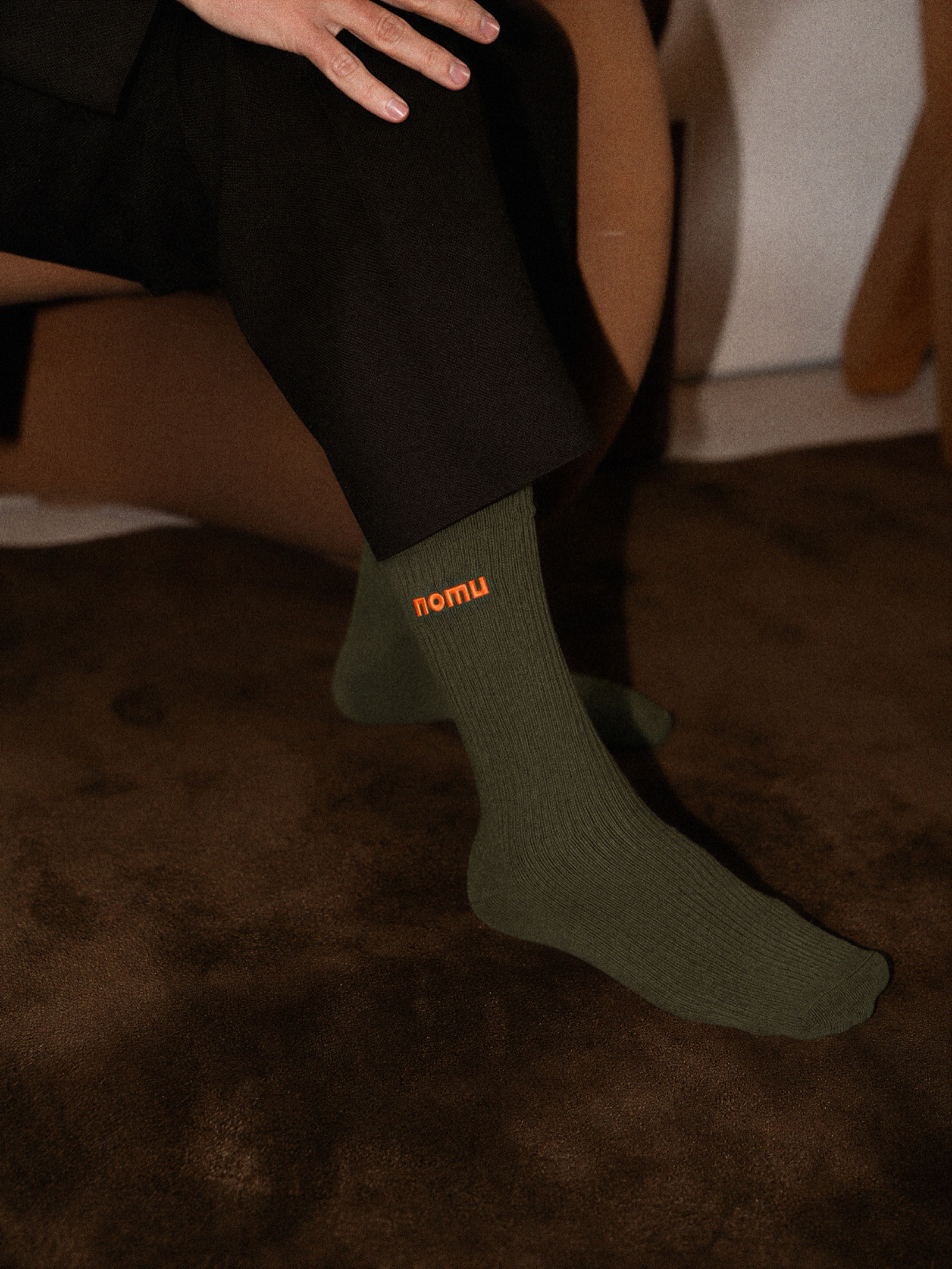 Olive Nomu socks with orange embroidery