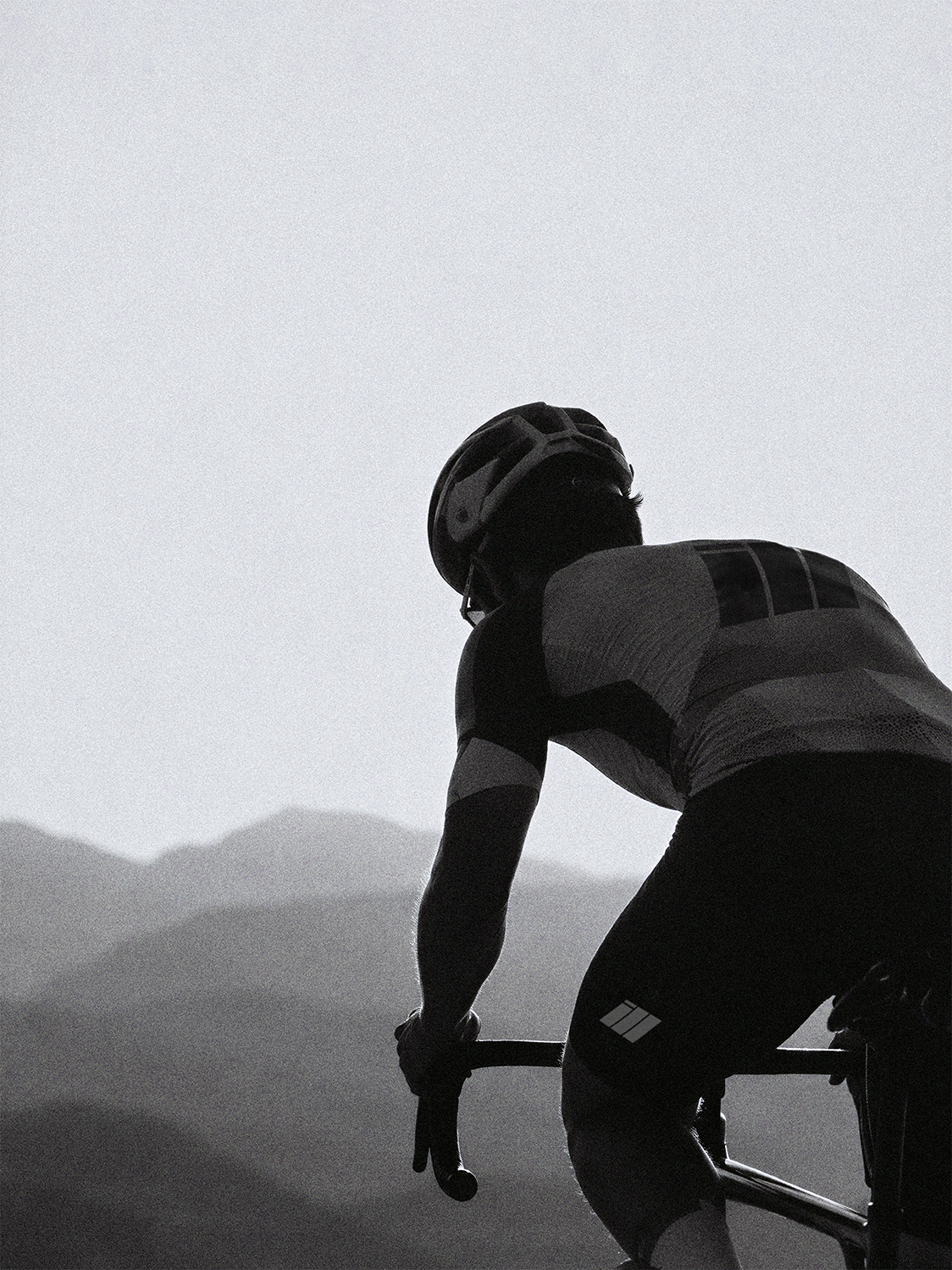Cyclist in ILL kit against mountains